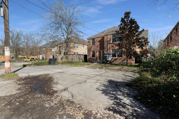 a view of a road with a building in the background