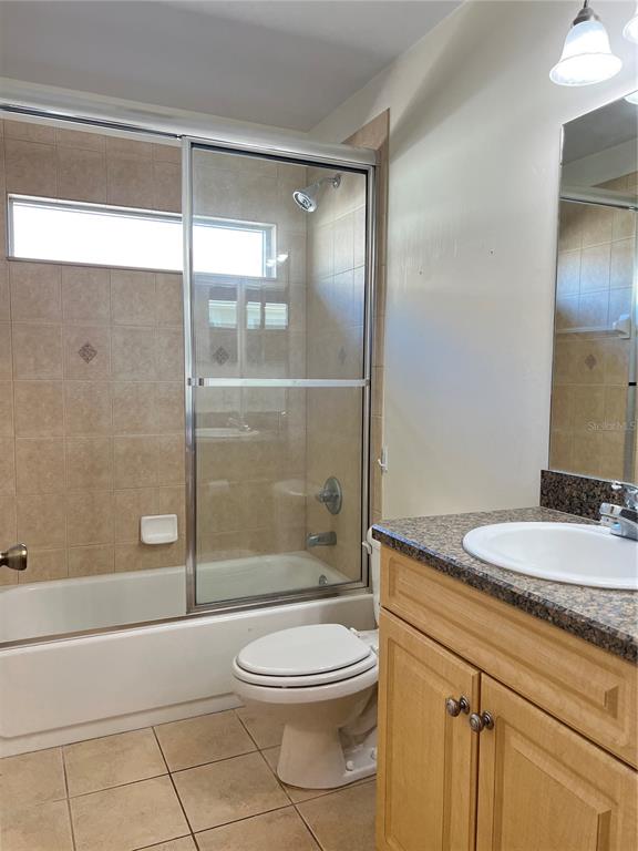 19430 Northwest 164th Road High Springs, FL 32643 - Photo 19 of 24 a bathroom with a granite countertop sink a toilet and shower