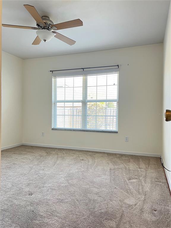 19430 Northwest 164th Road High Springs, FL 32643 - Photo 20 of 24 an empty room with a empty space and a ceiling fan