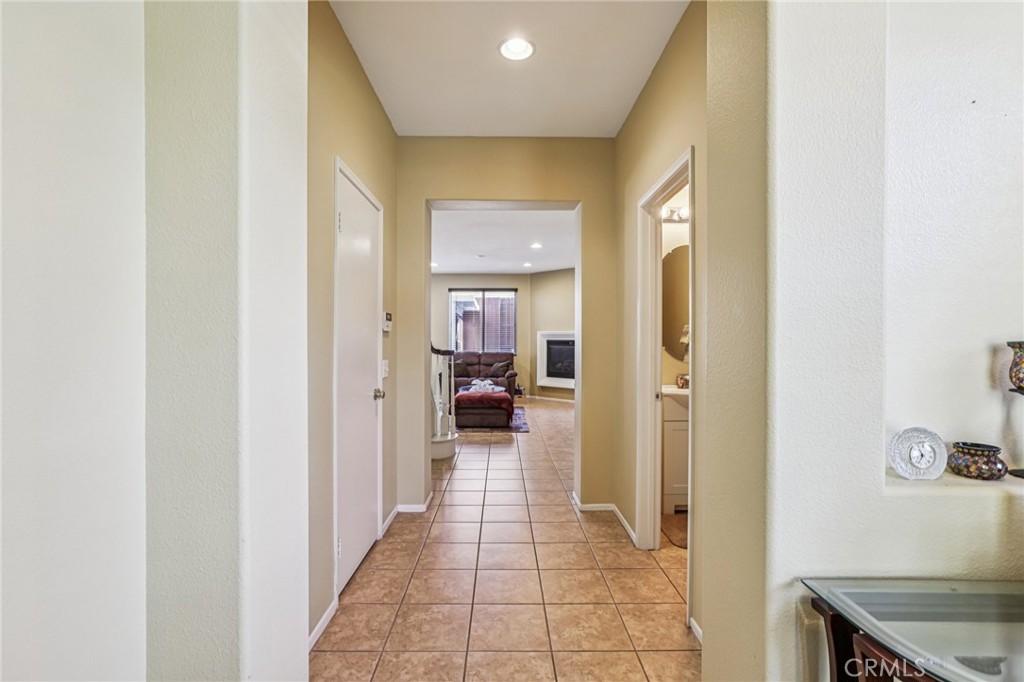 17550 Buttonwood Lane Carson, CA 90746 - Photo 14 of 43 a view of a hallway with living room and furniture