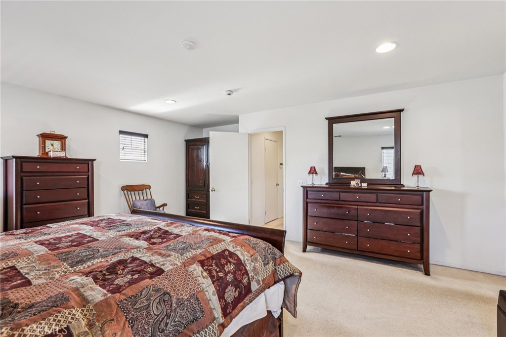 17550 Buttonwood Lane Carson, CA 90746 - Photo 19 of 43 a bed room with a bed and a dresser