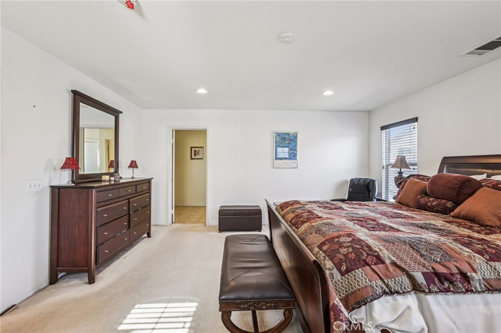 17550 Buttonwood Lane Carson, CA 90746 - Photo 21 of 43 a bedroom with a bed and a dresser