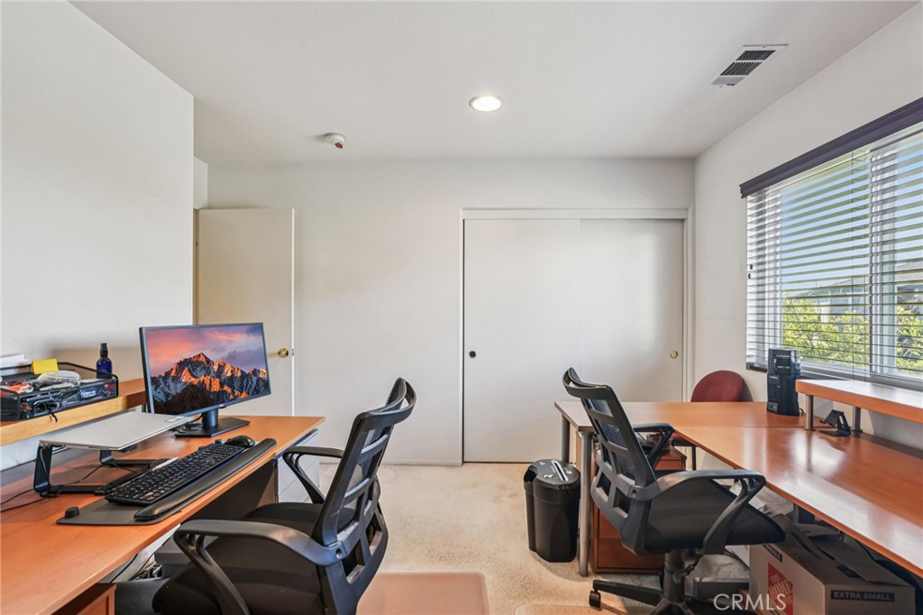 17550 Buttonwood Lane Carson, CA 90746 - Photo 28 of 43 a view of a workspace with furniture and a window