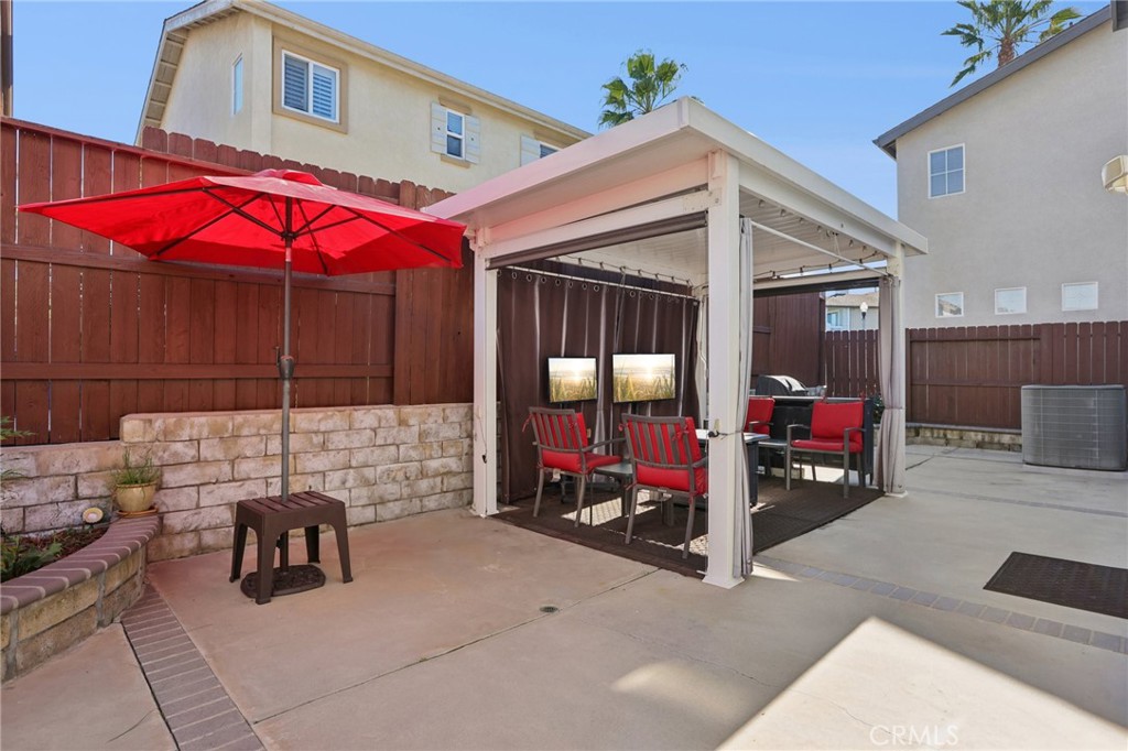 17550 Buttonwood Lane Carson, CA 90746 - Photo 32 of 43 a view of a patio with table and chairs