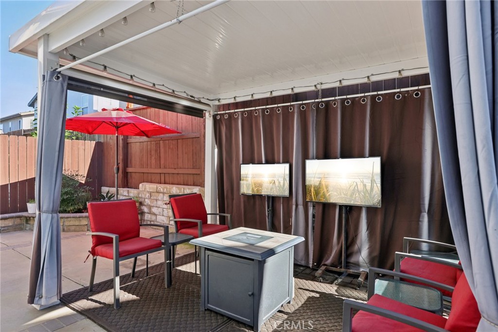 17550 Buttonwood Lane Carson, CA 90746 - Photo 34 of 43 a balcony with hardwood table and chairs