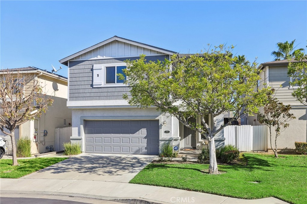17550 Buttonwood Lane Carson, CA 90746 - Photo 37 of 43 a front view of a house with a yard and garage