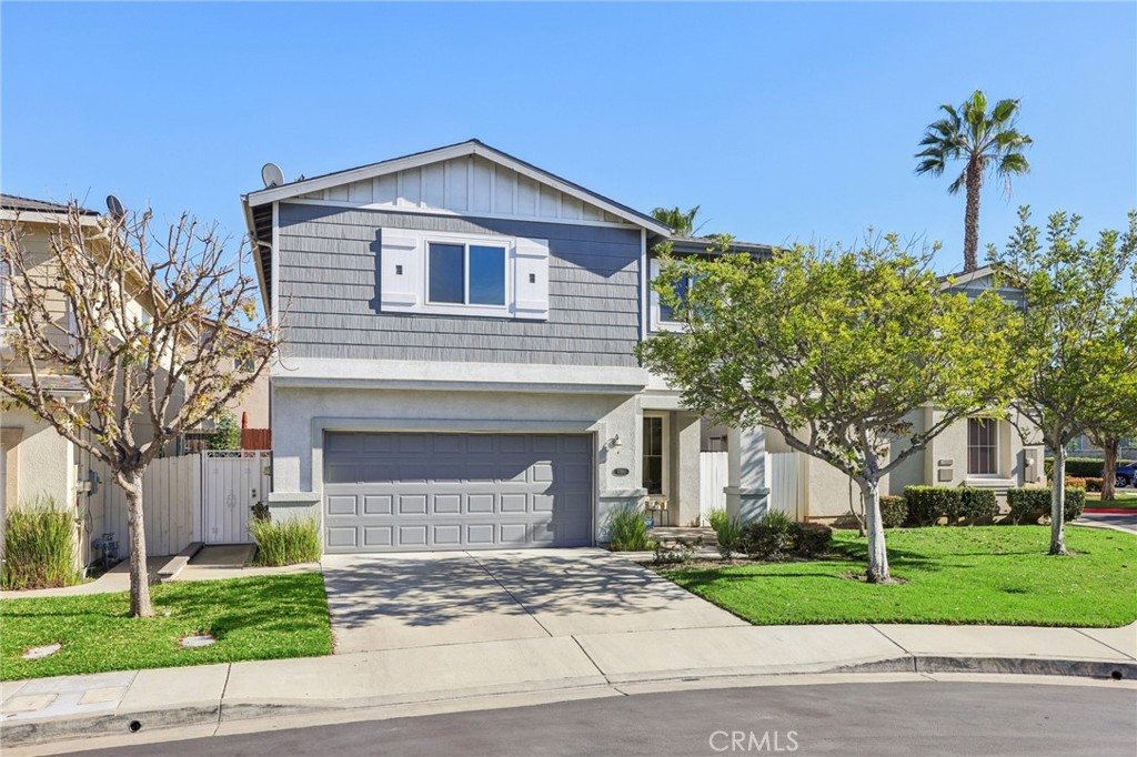 17550 Buttonwood Lane Carson, CA 90746 - Photo 38 of 43 a front view of a house with a garden and trees