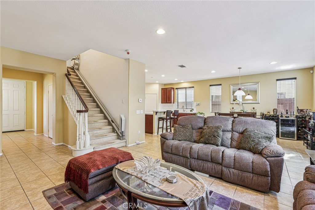 17550 Buttonwood Lane Carson, CA 90746 - Photo 7 of 43 a living room with furniture a wooden floor and next to a window