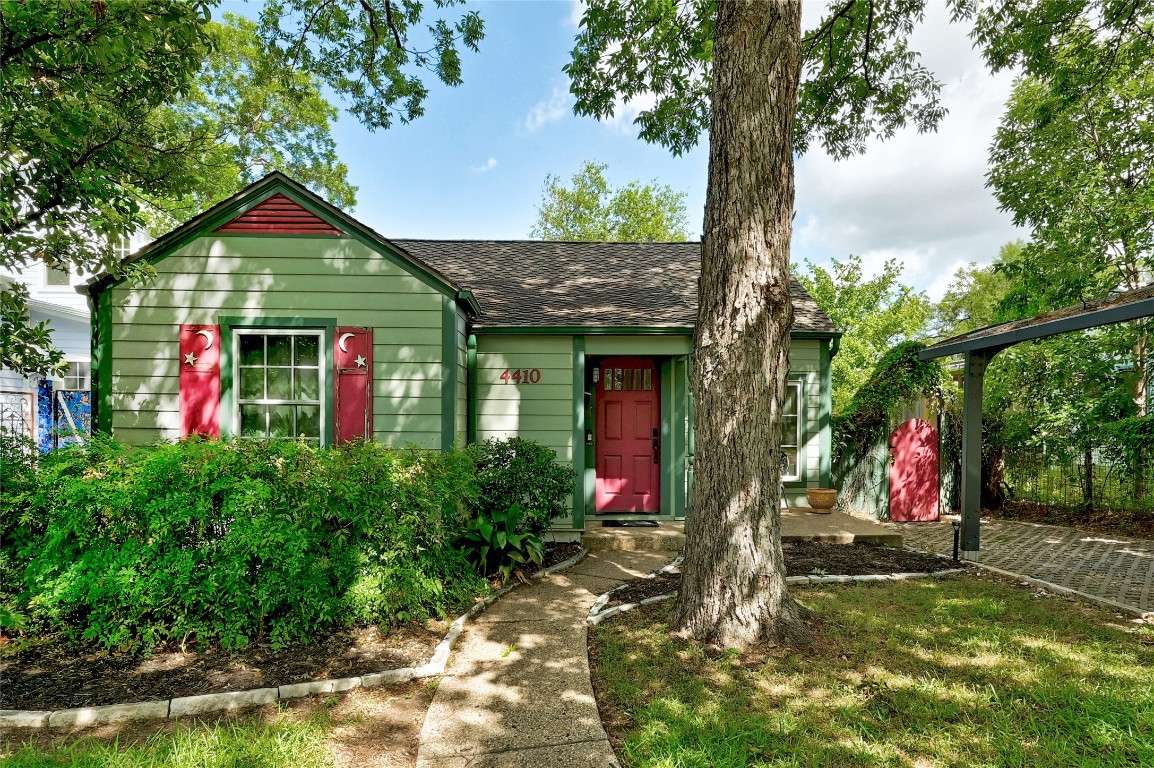 a view of a bird house next to a yard