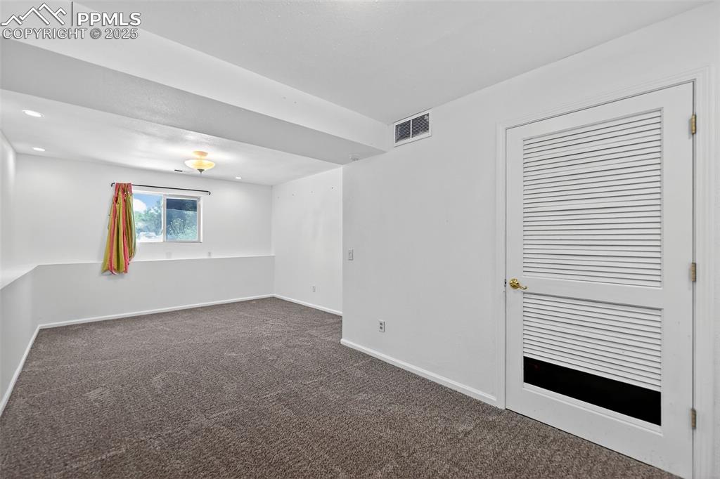 305 Iris Drive Fountain, CO 80817 - Photo 18 of 22 a view of an empty room with a window
