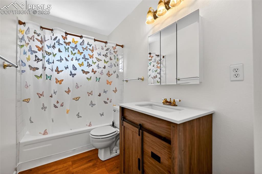 305 Iris Drive Fountain, CO 80817 - Photo 8 of 22 a bathroom with a sink toilet and shower