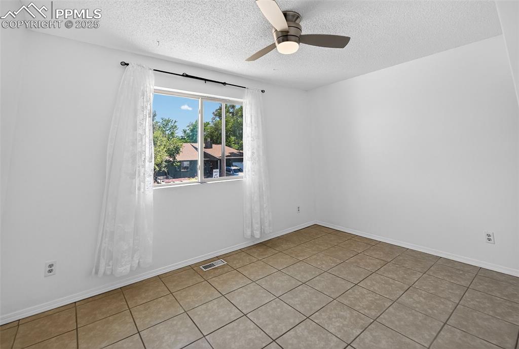 305 Iris Drive Fountain, CO 80817 - Photo 9 of 22 a view of an empty room with a window