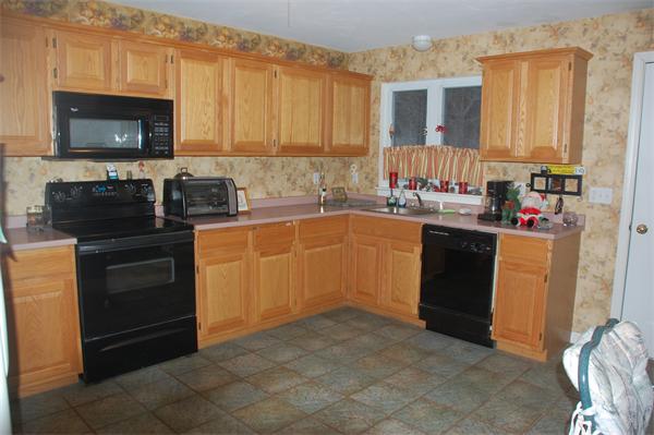 11 Longley Road, Unit G1 Shirley, MA 01464 - Photo 3 of 12 a kitchen with a sink stove top oven and cabinets