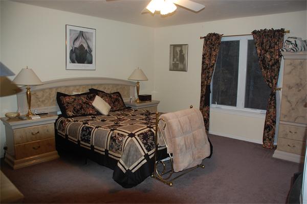 11 Longley Road, Unit G1 Shirley, MA 01464 - Photo 5 of 12 a bedroom with a bed and a walk in closet