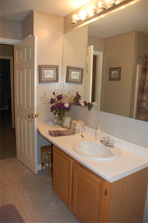 11 Longley Road, Unit G1 Shirley, MA 01464 - Photo 7 of 12 a bathroom with a sink and a mirror