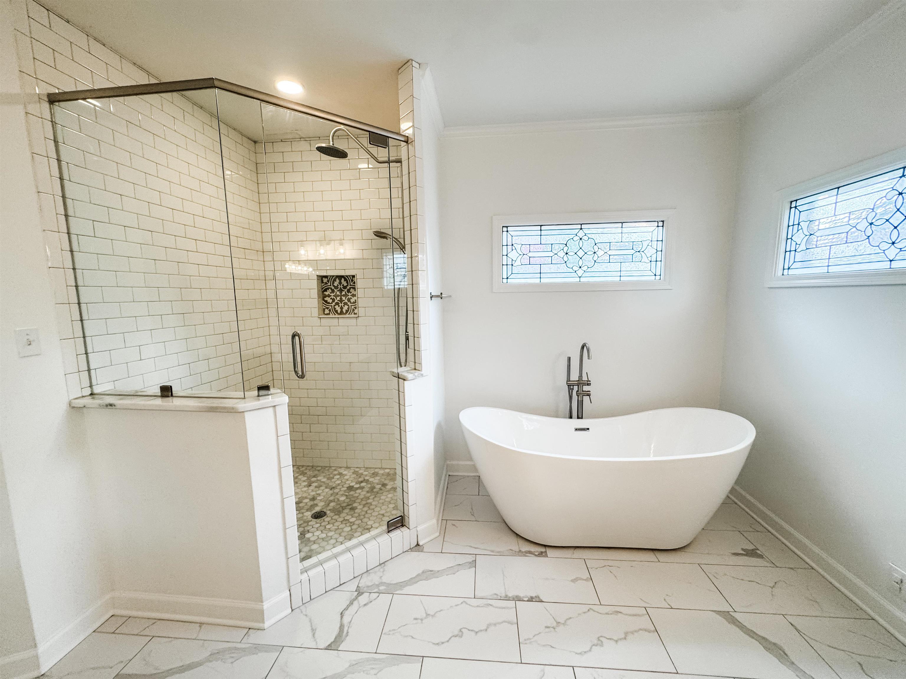 705 Cotham Drive Collierville, TN 38017 - Photo 17 of 22 a spacious bathroom with a bathtub and shower