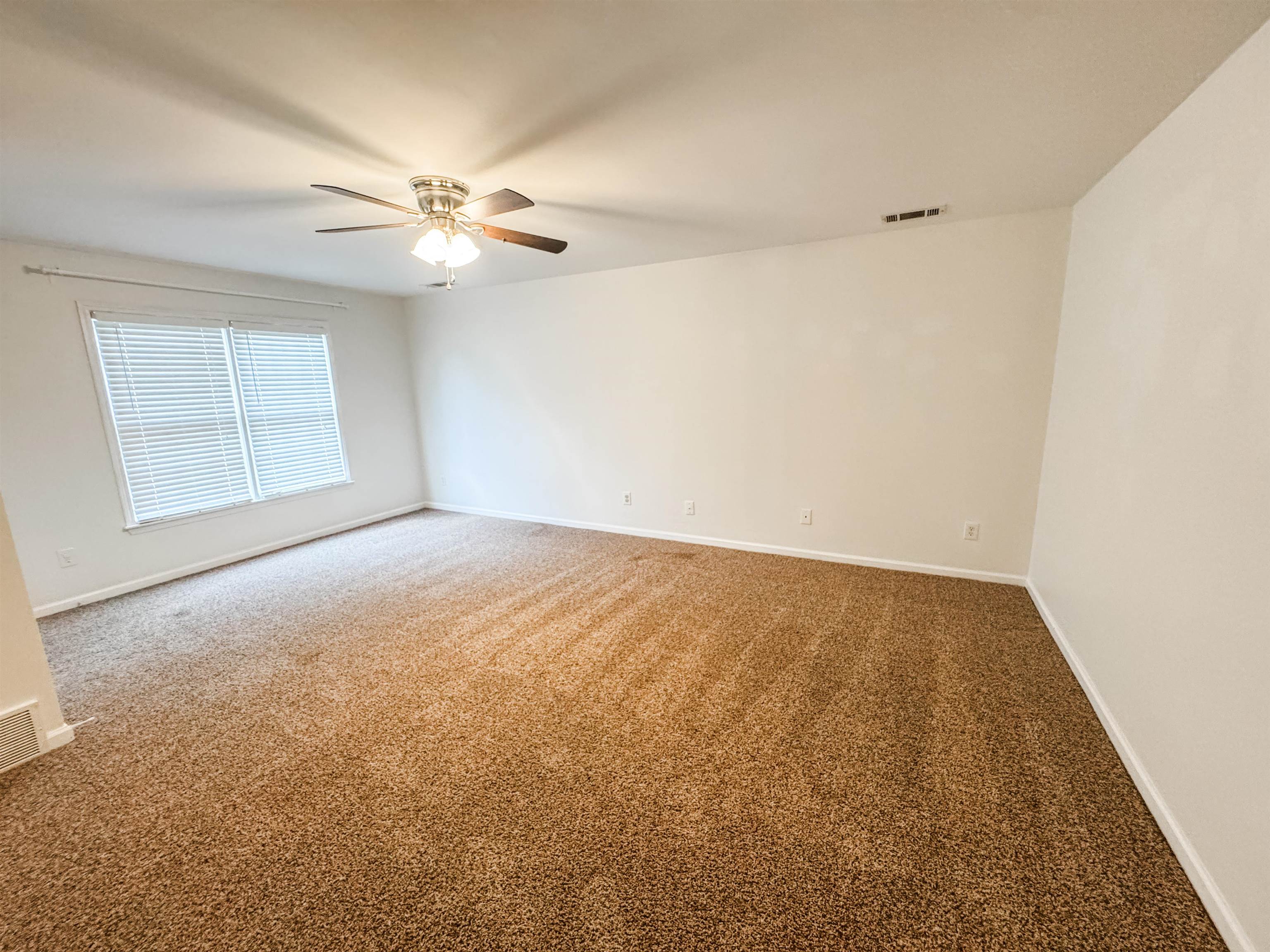 705 Cotham Drive Collierville, TN 38017 - Photo 21 of 22 an empty room with windows and fan