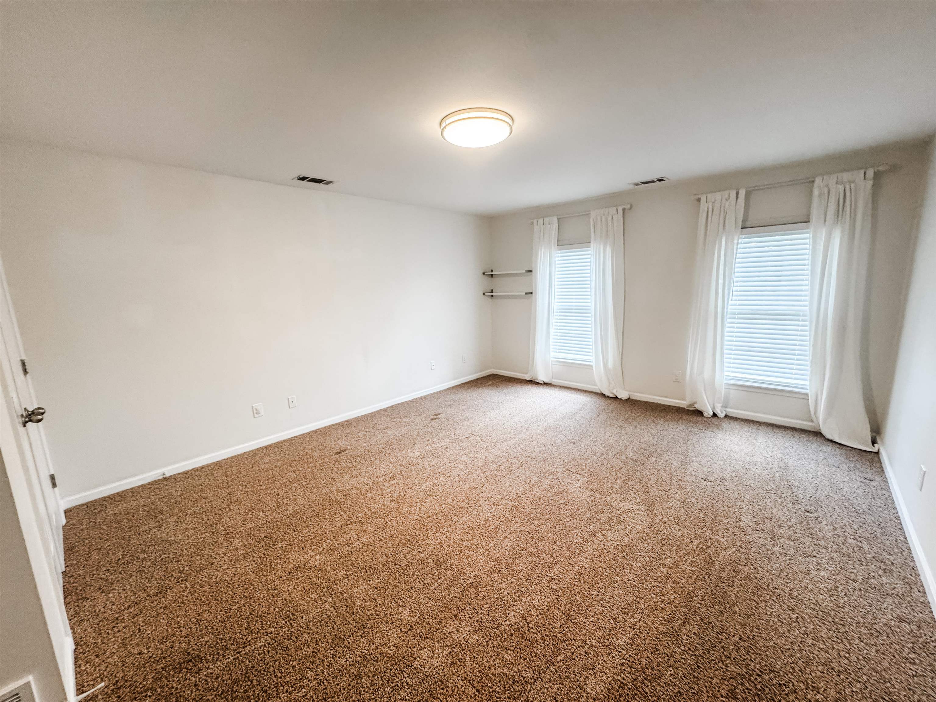 705 Cotham Drive Collierville, TN 38017 - Photo 22 of 22 an empty room with a natural light