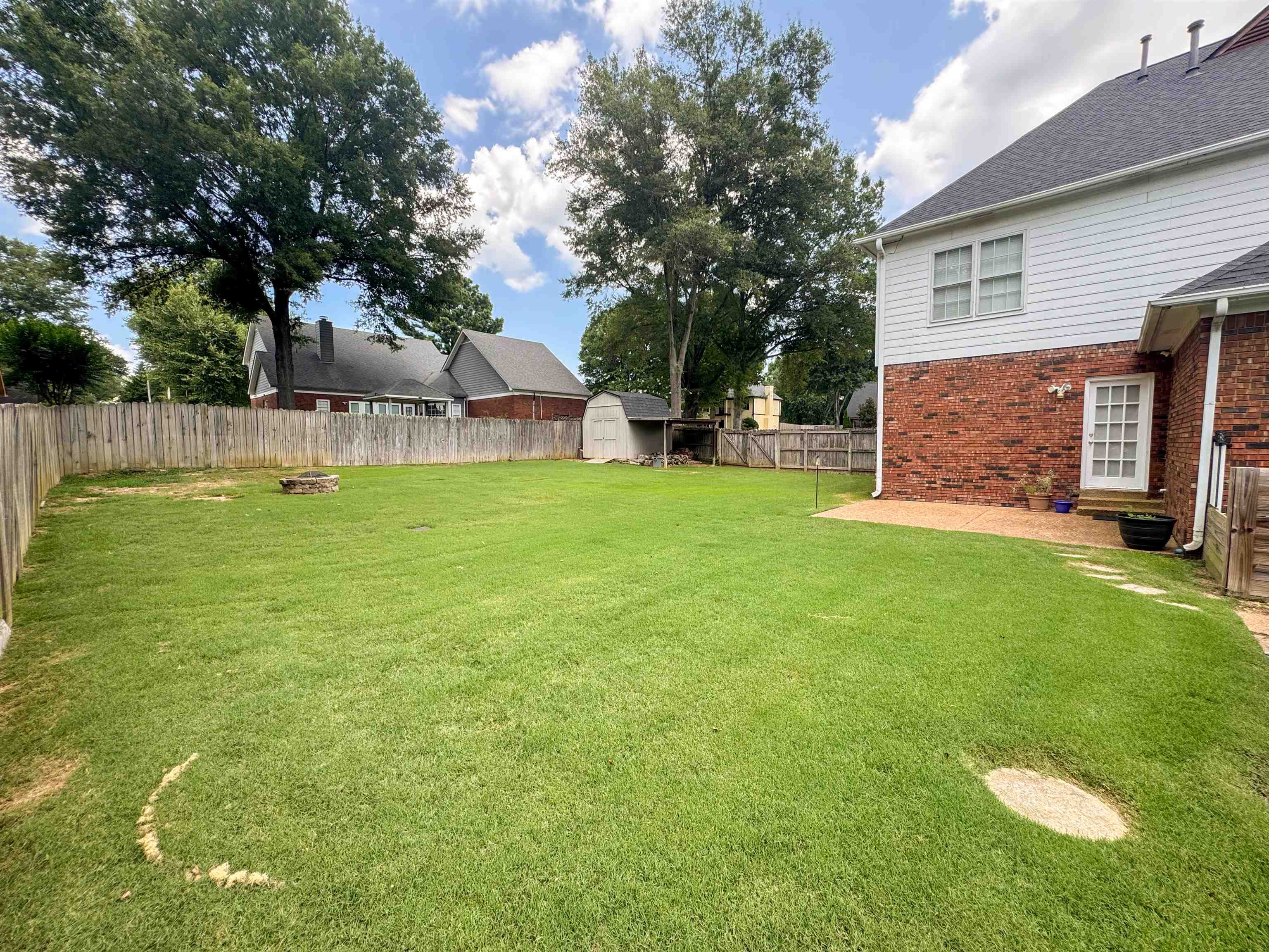 705 Cotham Drive Collierville, TN 38017 - Photo 4 of 22 a view of a backyard with a garden