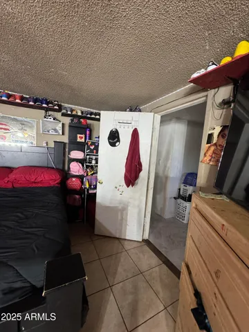 a view of a patio with table and chairs and potted plants