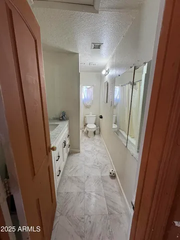 a bathroom with sink a mirror a bathtub and a shower