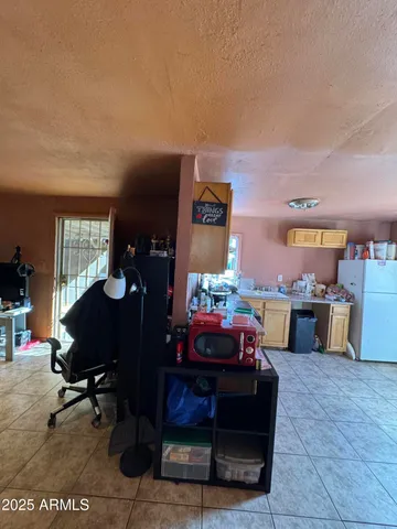 a living room with furniture a rug and a fireplace