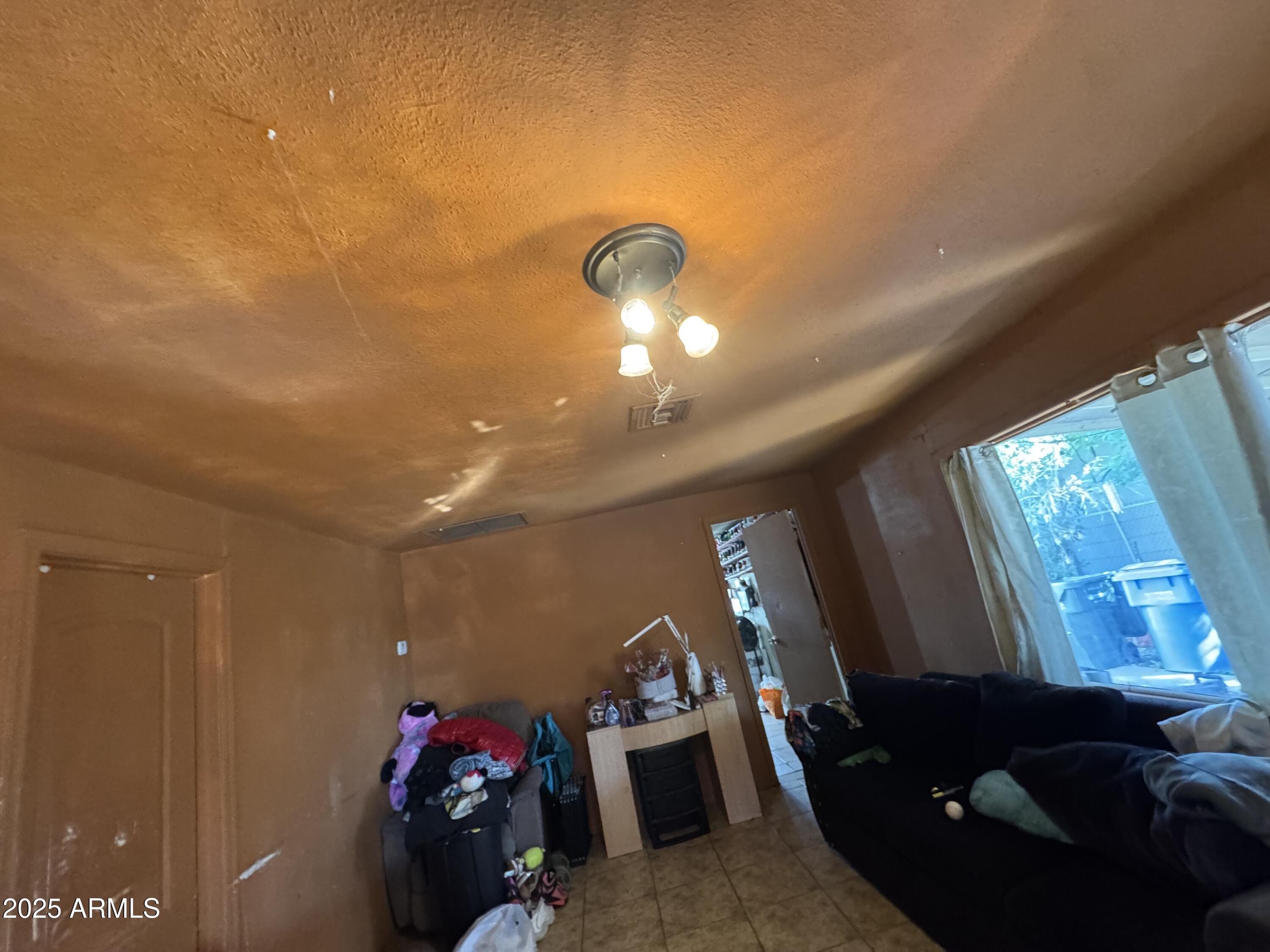 2425 West Papago Street Phoenix, AZ 85009 - Photo 8 of 16 a view of a room with gym equipment