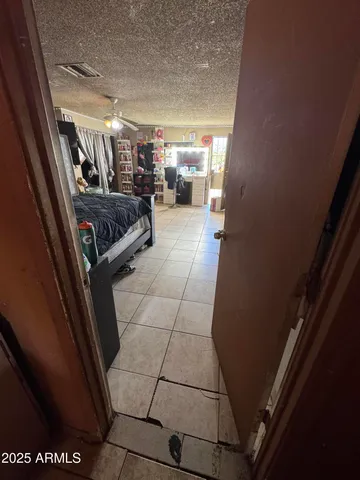 a bedroom with a bed and a walk in closet