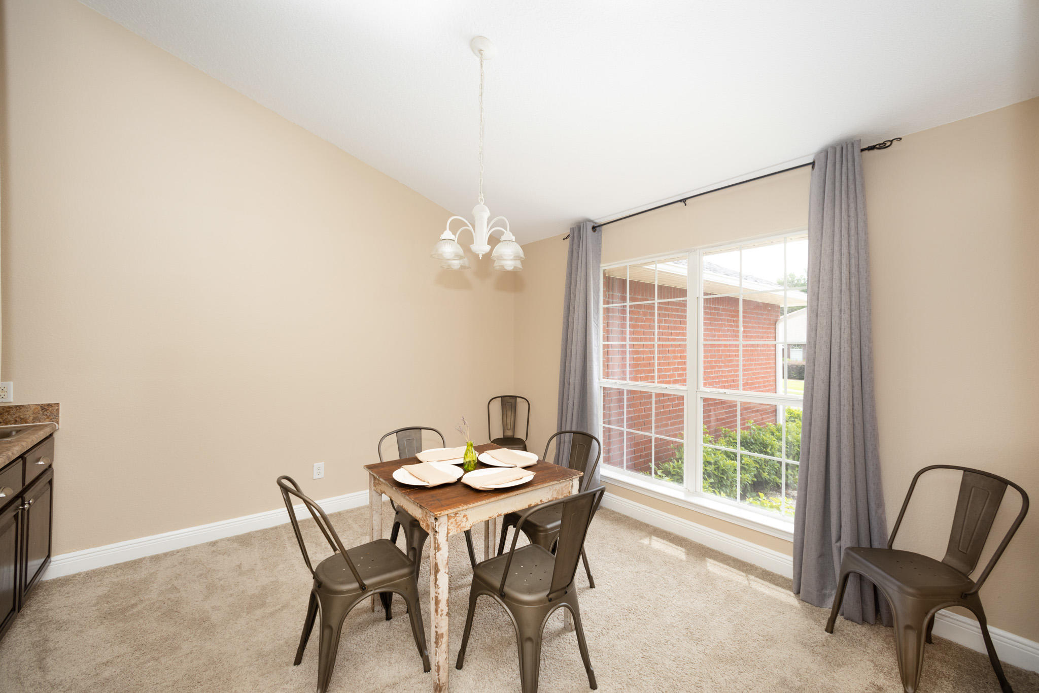 653 Territory Lane Crestview, FL 32536 - Photo 11 of 29 a view of a dining room with furniture and a window