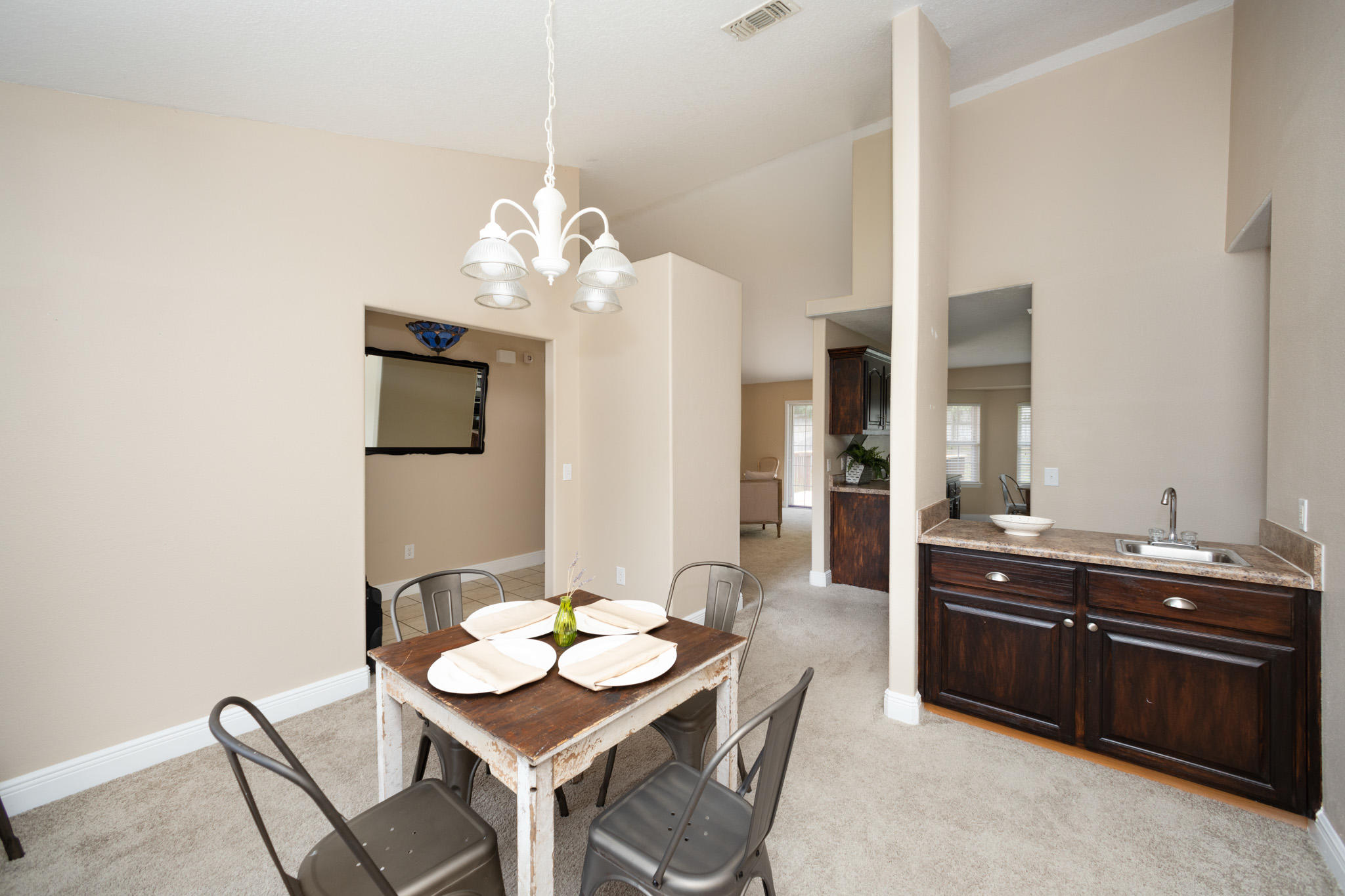 653 Territory Lane Crestview, FL 32536 - Photo 12 of 29 a view of a dining room with furniture and chandelier