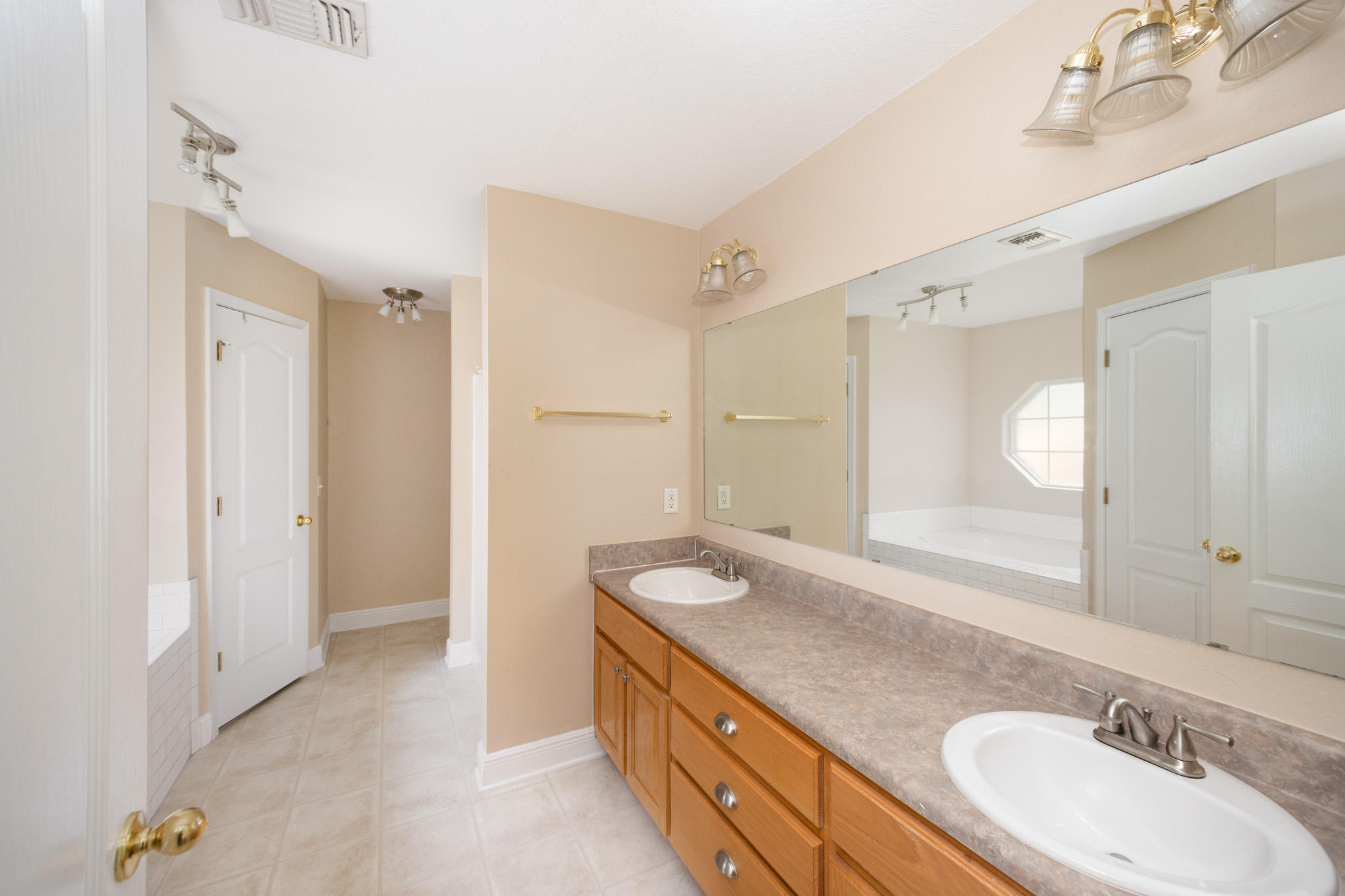 653 Territory Lane Crestview, FL 32536 - Photo 16 of 29 a bathroom with a granite countertop double vanity sink mirror and double
