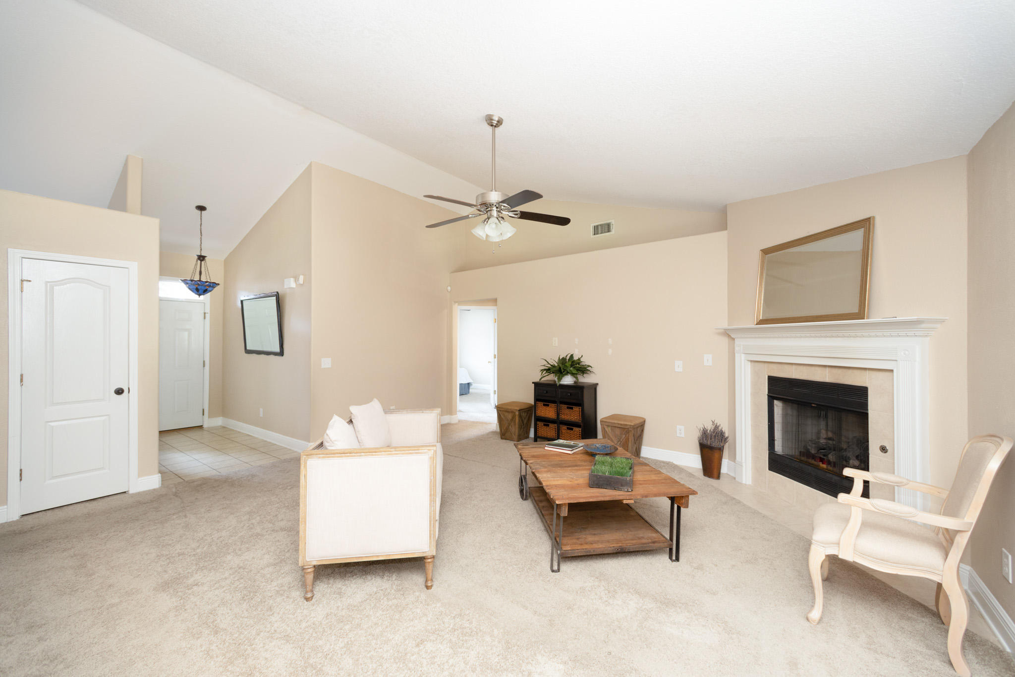 653 Territory Lane Crestview, FL 32536 - Photo 3 of 29 a living room with furniture and a fireplace