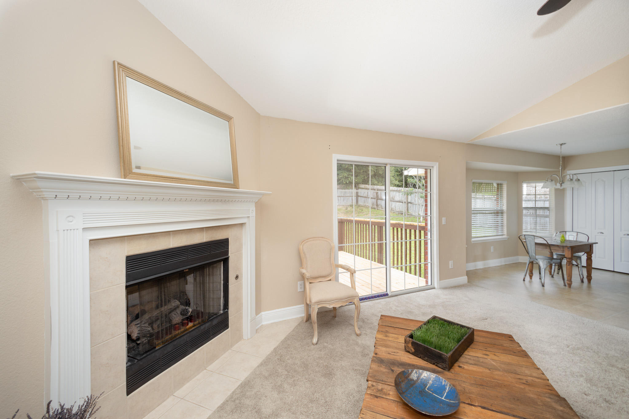 653 Territory Lane Crestview, FL 32536 - Photo 5 of 29 a living room with furniture a fireplace and a table