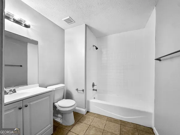 a view of large space with a big yard