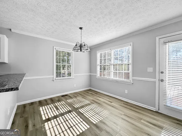 a view of an empty room with windows