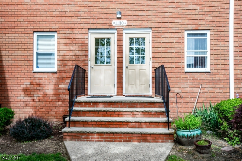 1130 Valley Road, Unit 2B Wayne, NJ 07470 - Photo 35 of 47 a front view of a house with a garden