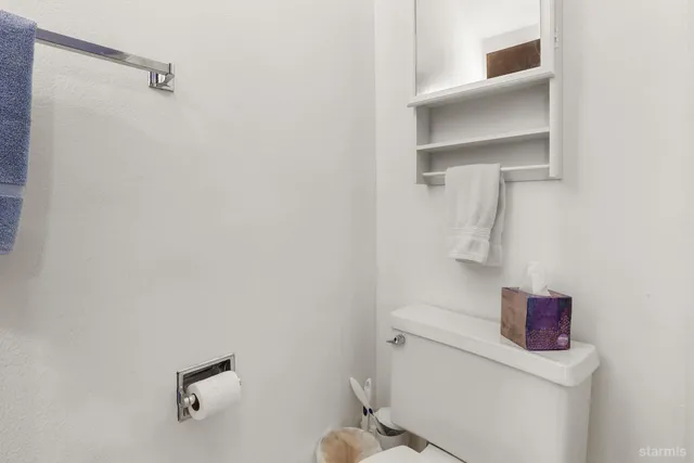 a bathroom with a toilet and a sink