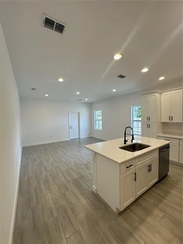 a kitchen with a stove and a sink
