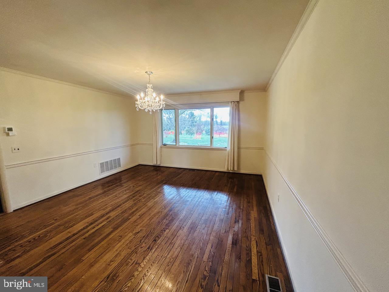 14820 Old York Road Phoenix, MD 21131 - Photo 9 of 22 wooden floor in an empty room with a window