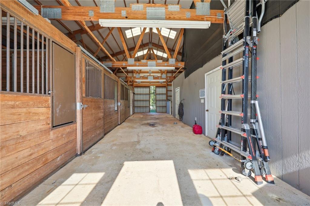 8861 Boylston Road Colfax, NC 27235 - Photo 46 of 50 Thoughtfully designed for everyday use, the barn features three stalls, excellent ventilation, natural lighting, and ample room to work comfortably.