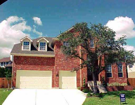 10209 Chestnut Ridge Road Austin, TX 78726 - Photo 1 of 1 a front view of a house with garden