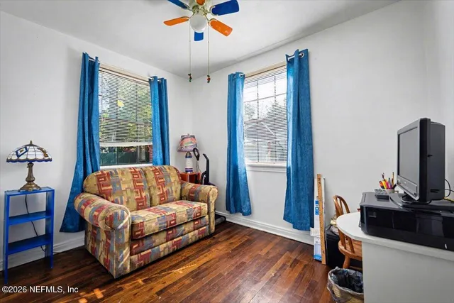 a bed sitting in a room next to a window