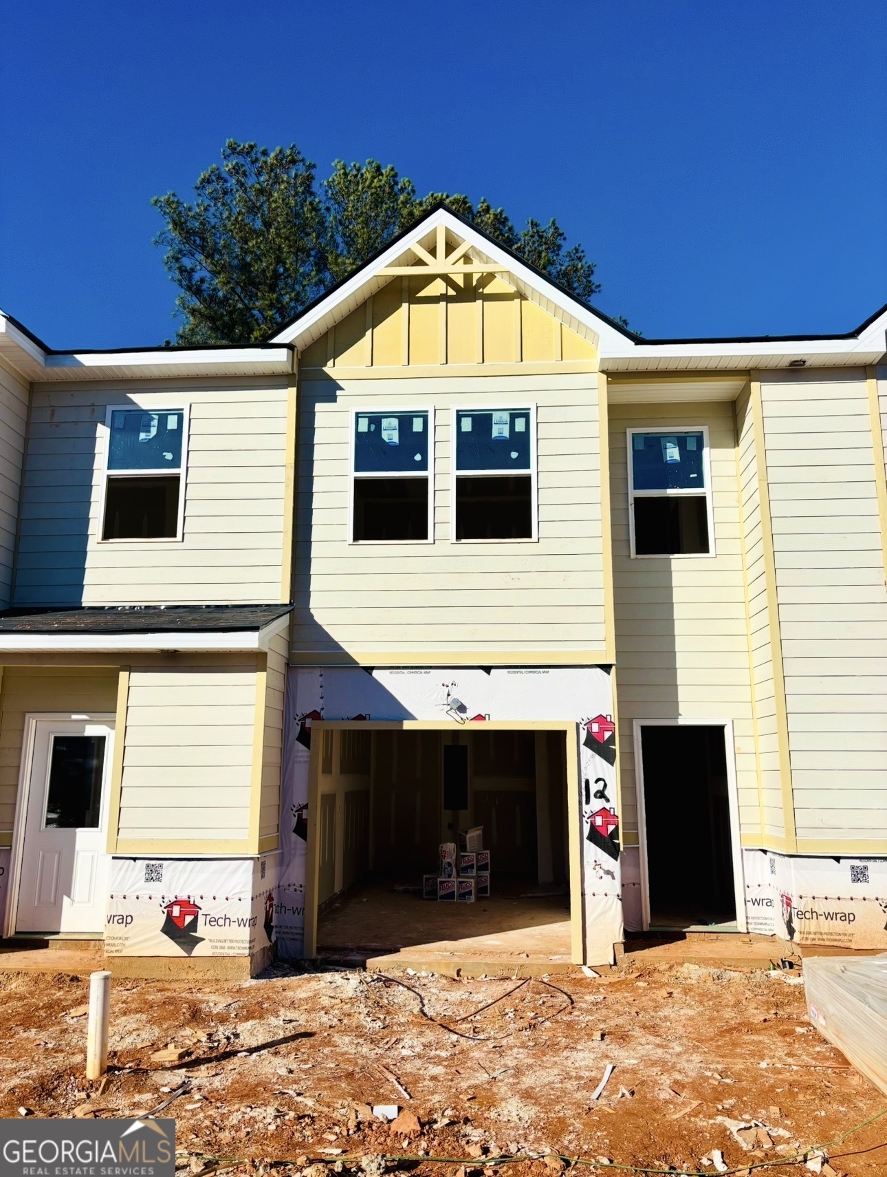 a front view of a house with a garage