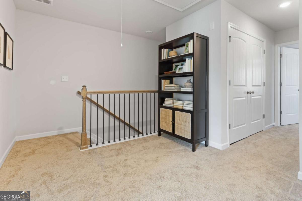 124 Meadowview Drive, Unit 12 Temple, GA 30179 - Photo 14 of 27 a view of a hallway with closet