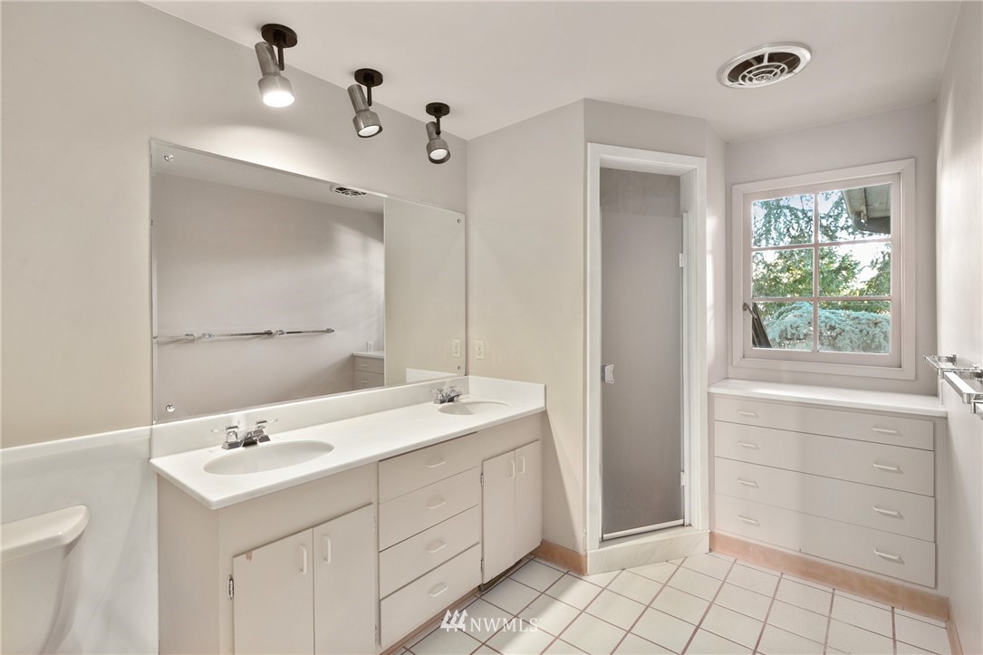 5527 Northeast Windermere Road Seattle, WA 98105 - Photo 23 of 34 a bathroom with a sink vanity and mirror