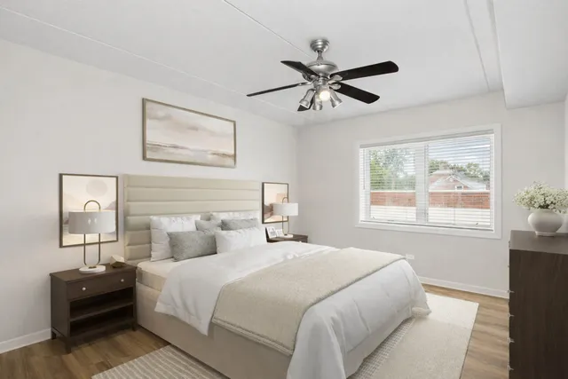 a bedroom with a large bed and a window