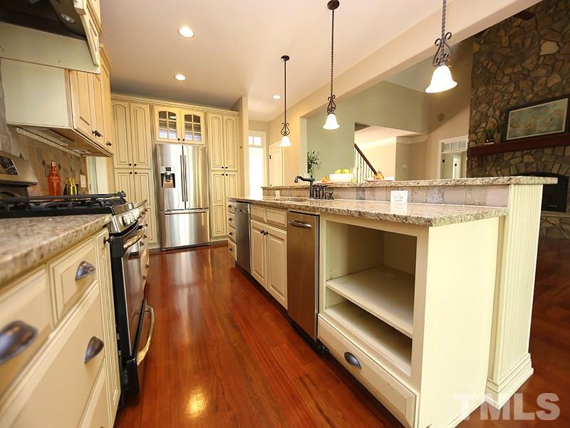 3460 Century Farm Road Wake Forest, NC 27587 - Photo 14 of 25 a kitchen with stainless steel appliances granite countertop a stove and a sink