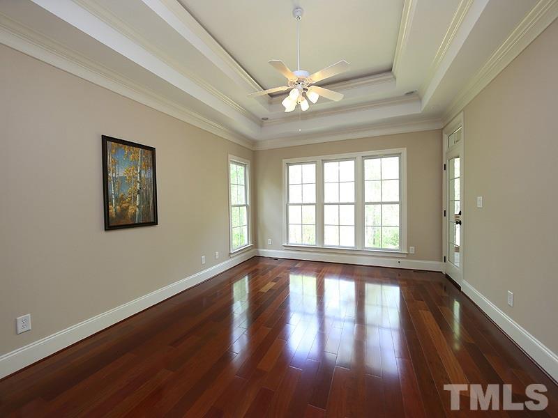 3460 Century Farm Road Wake Forest, NC 27587 - Photo 18 of 25 a view of an empty room with wooden floor and a window