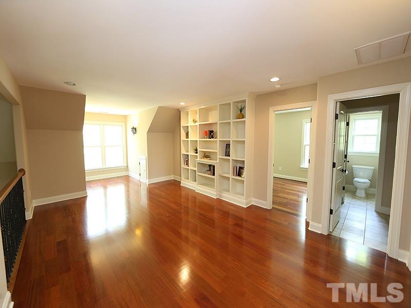 3460 Century Farm Road Wake Forest, NC 27587 - Photo 21 of 25 a view of a big room with wooden floor and a kitchen