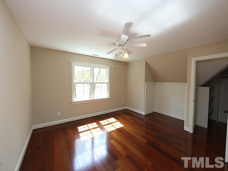 3460 Century Farm Road Wake Forest, NC 27587 - Photo 24 of 25 a view of empty room with wooden floor and fan